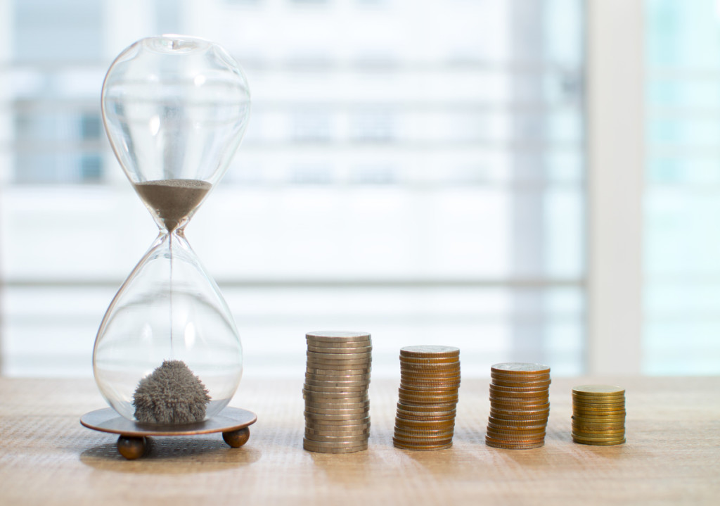 Money saving in the glass bottle for money concept